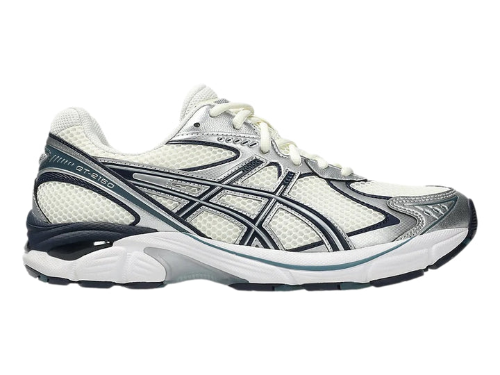 Tenis deportivos ASICS GT-2160 color crema con detalles en azul marino y plata.