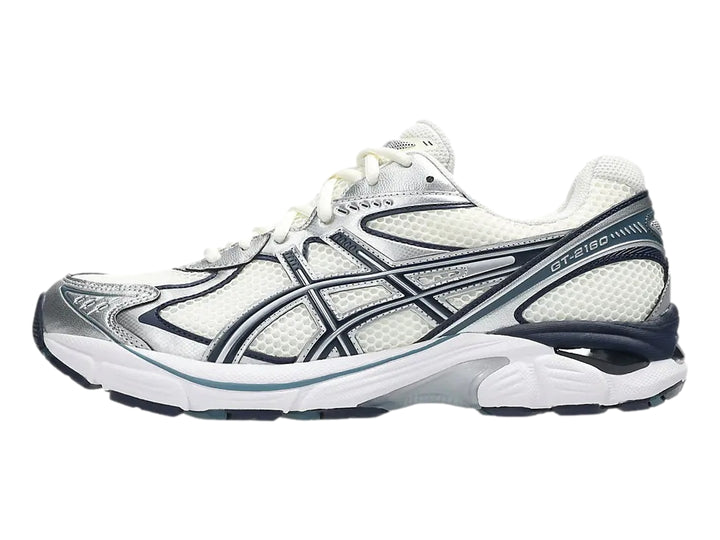 Tenis deportivos ASICS GT-2160 color crema con detalles en azul marino y plata.