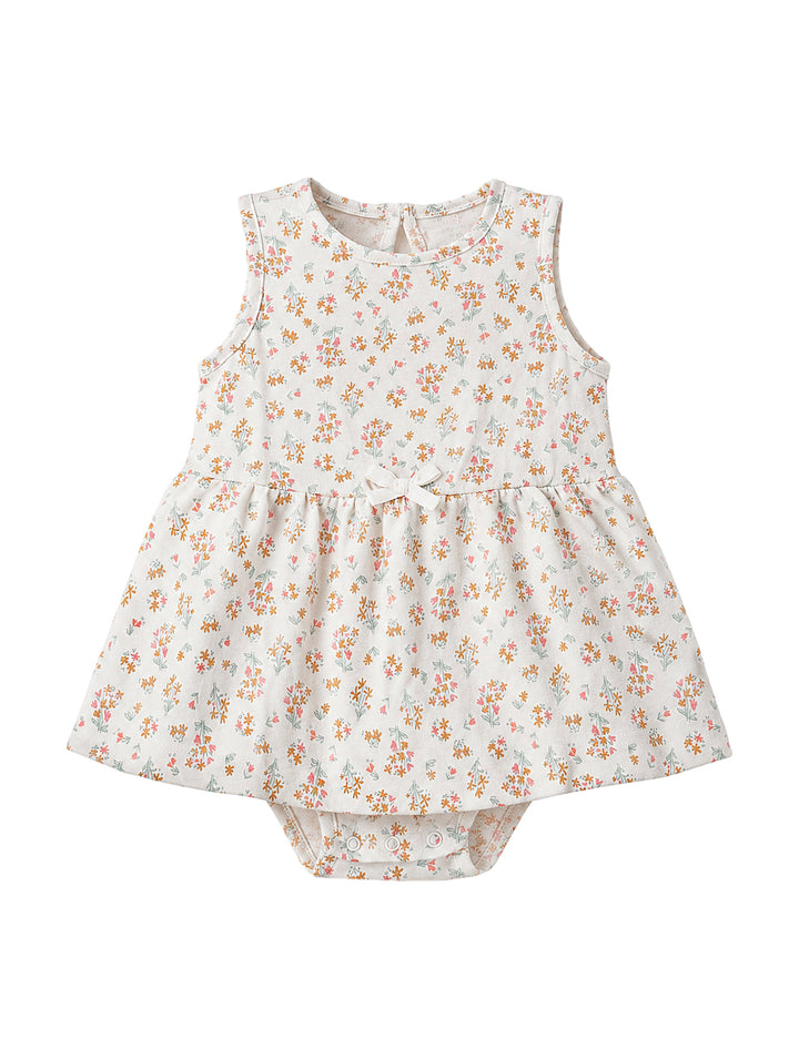 Vestido pañalero color ivory con estampado floral pequeño y moño al frente para niña.