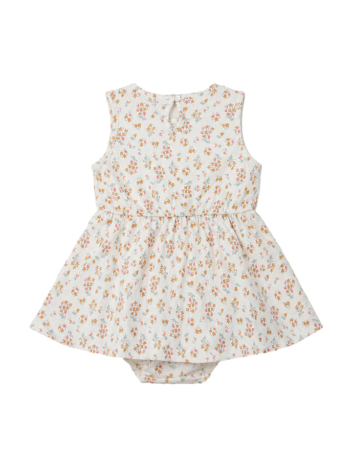 Vestido pañalero color ivory con estampado floral pequeño y moño al frente para niña.