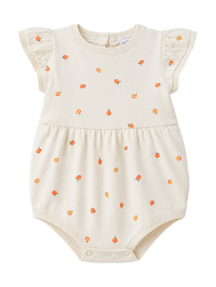 Romper color ivory para niña con estampado de pequeñas naranjas y mangas volantes.