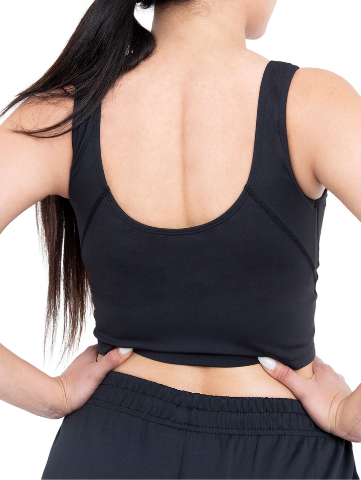 Top deportivo negro de marca Voit para mujer, estilo crop top con cuello redondo.