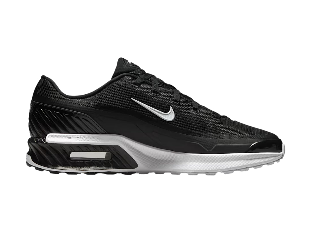 Tenis Nike Air Max color negro con suela blanca y logotipo de la marca en blanco.