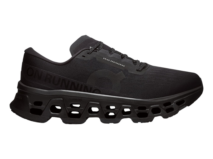 Tenis deportivos On Cloudmonster 3 color negro con suela de amortiguación característica.