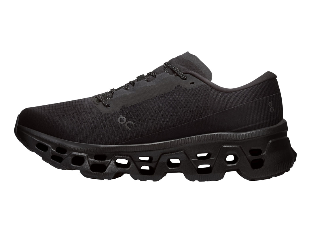 Tenis deportivos On Cloudmonster 3 color negro con suela de amortiguación característica.