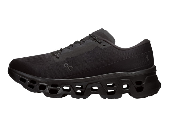 Tenis deportivos On Cloudmonster 3 color negro con suela de amortiguación característica.