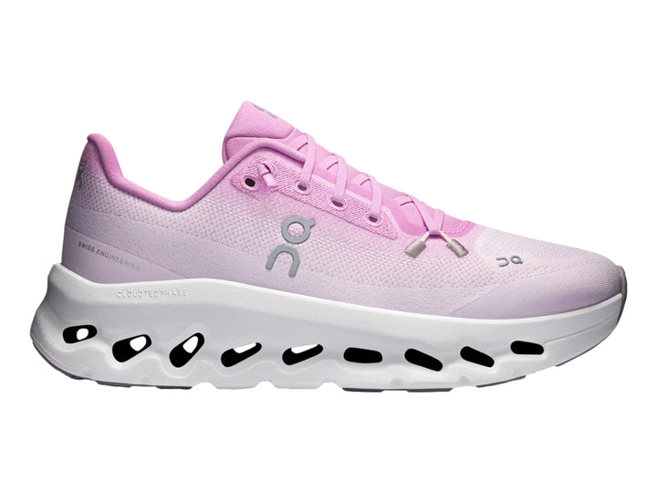 Tenis deportivos On Cloud en color rosa sakura con suela blanca amortiguada.