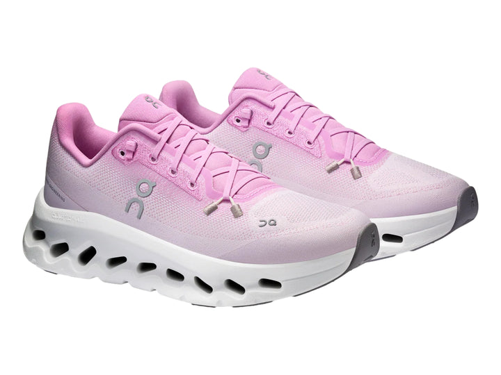 Tenis deportivos On Cloud en color rosa sakura con suela blanca amortiguada.