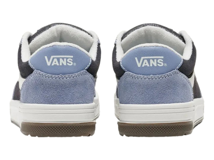 Tenis Vans azul y negro con franja lateral blanca y suela blanca