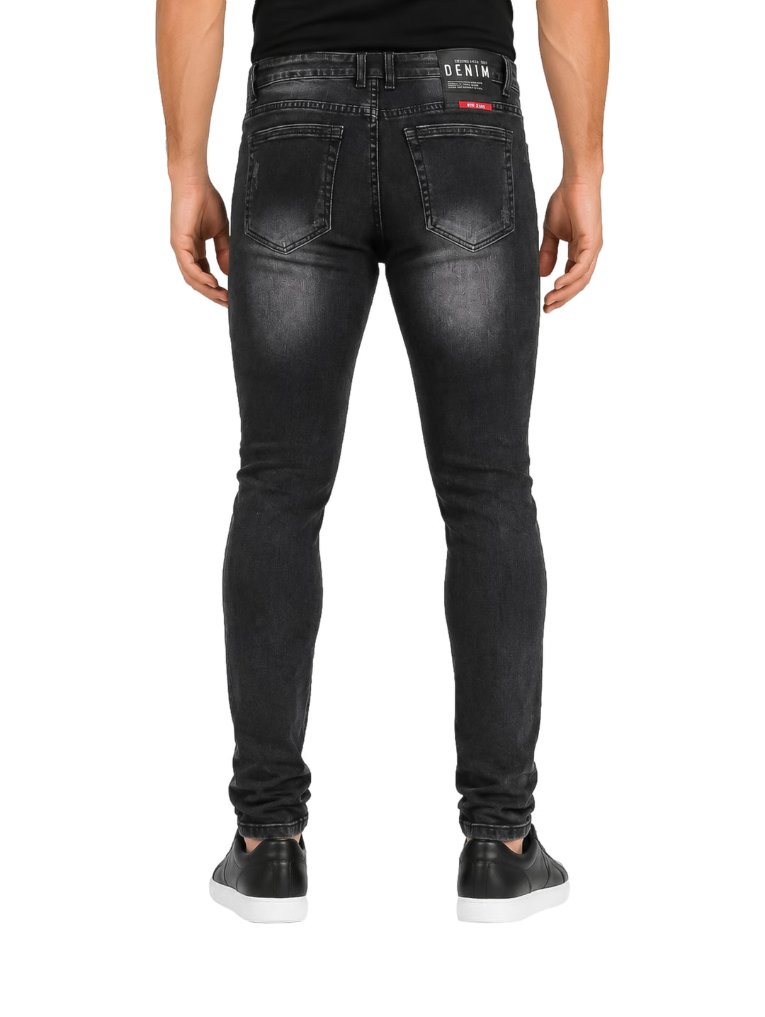 Jeans color negro para hombre con efecto desgastado y corte ajustado.