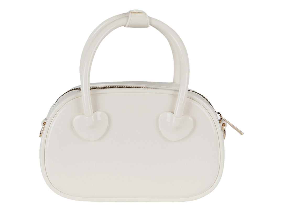 Bolsa de plástico color latte con detalles de corazones y asa superior.