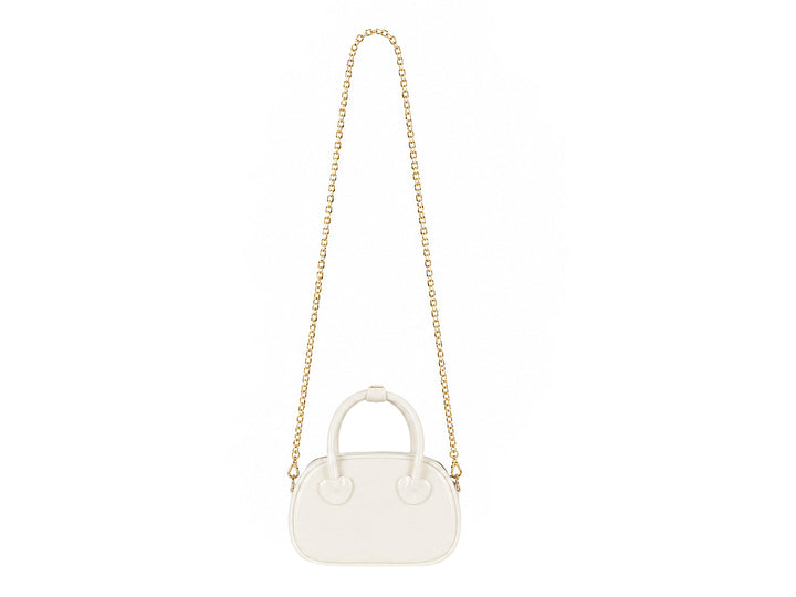 Bolsa de plástico color latte con detalles de corazones y asa superior.