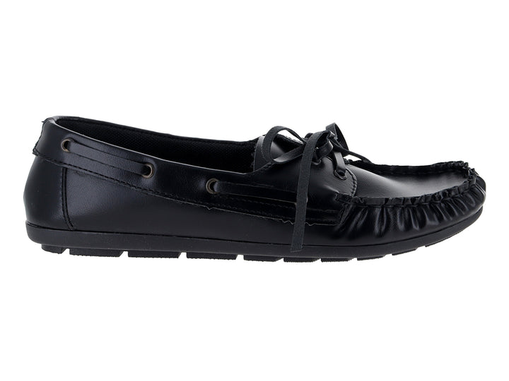 Mocasín negro de la marca Nomadas con cordones decorativos y suela dentada sobre fondo blanco.