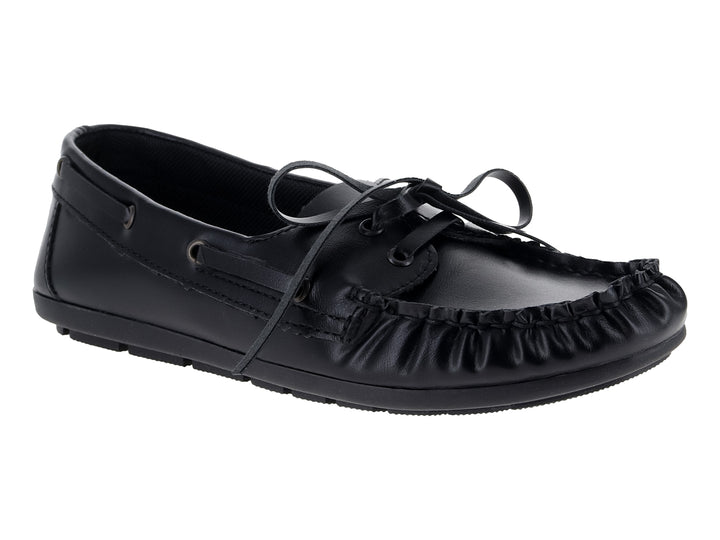 Mocasín negro de la marca Nomadas con cordones decorativos y suela dentada sobre fondo blanco.
