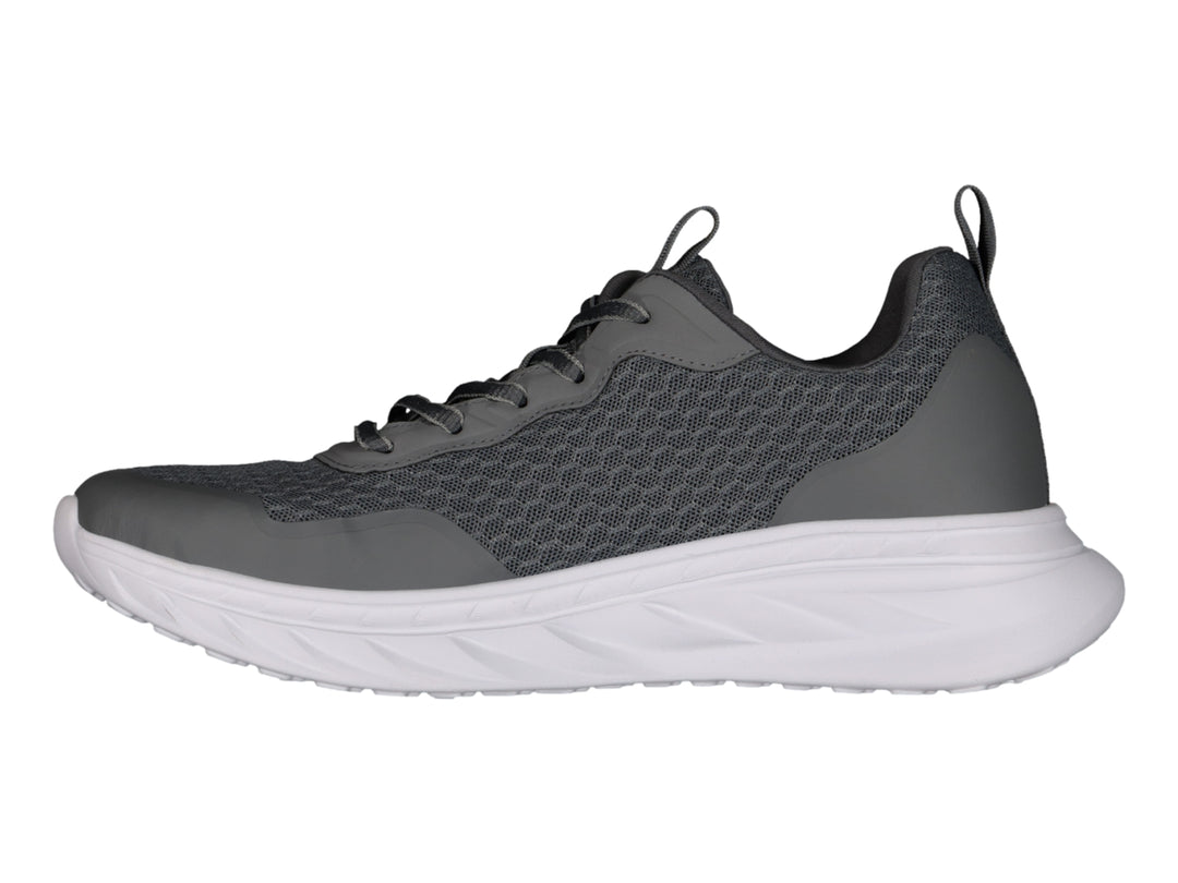 Tenis Charly Road Casual en color gris oscuro con suela blanca y tejido transpirable.