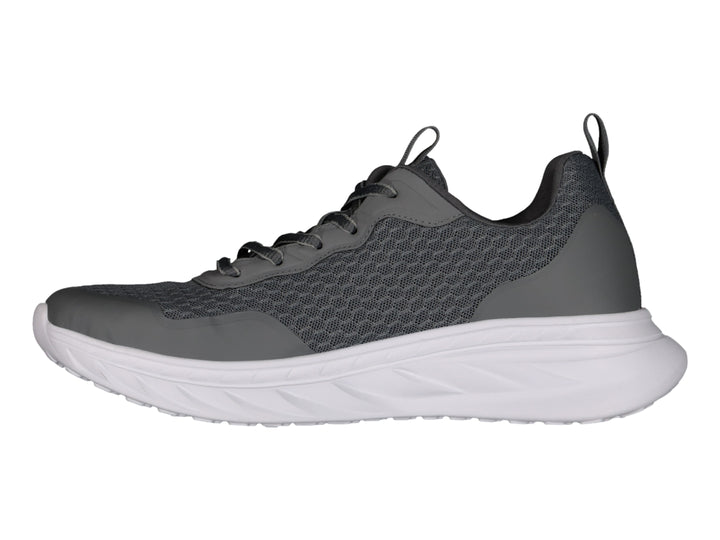 Tenis Charly Road Casual en color gris oscuro con suela blanca y tejido transpirable.