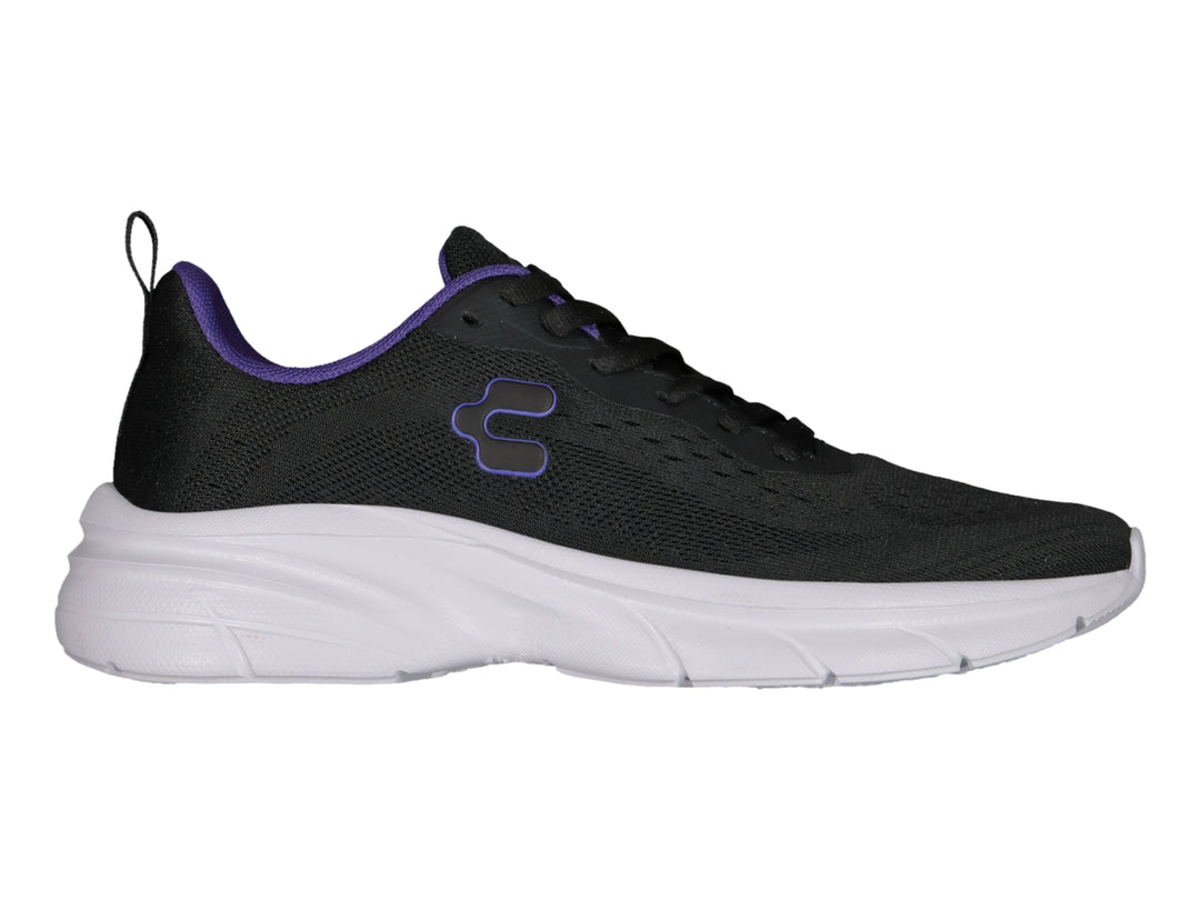 Tenis deportivos Charly color negro con suela blanca y detalles en morado.