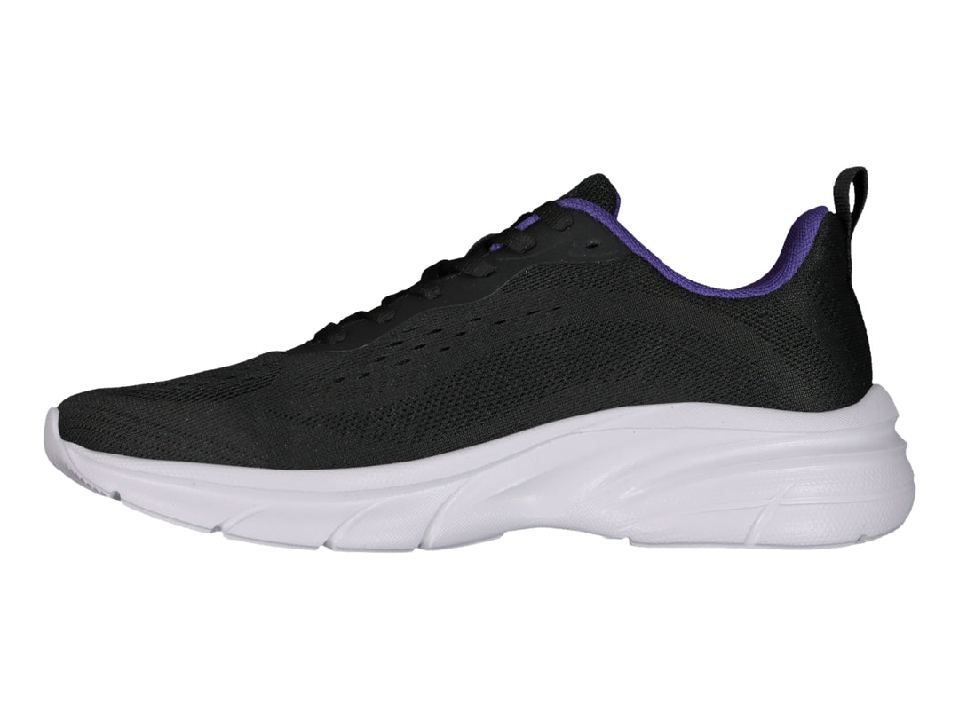 Tenis deportivos Charly color negro con suela blanca y detalles en morado.