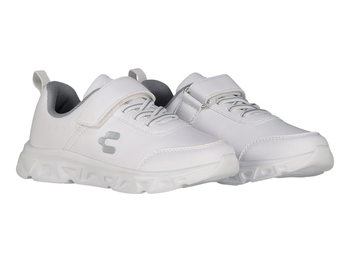 Tenis deportivos Charly color blanco para niño con cierre de velcro y suela blanca robusta.
