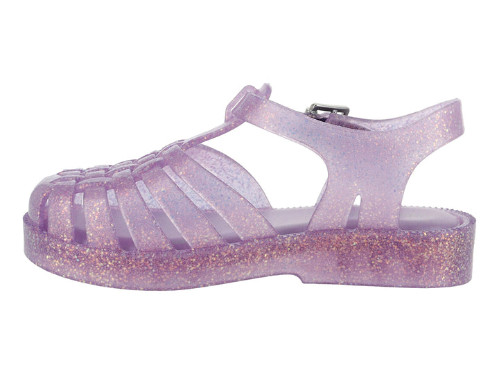 Sandalia morada con glitter para bebé de la marca Mini Melissa, con diseño calado y correa con hebilla.