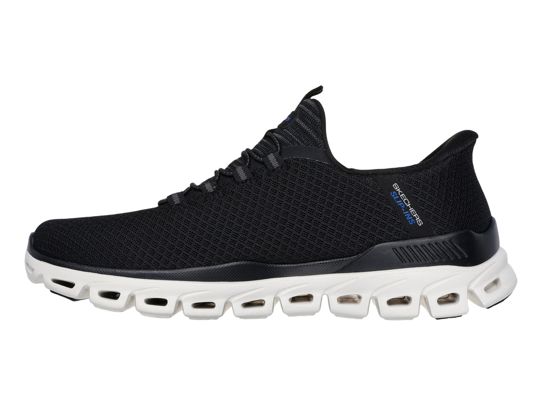 Tenis deportivos Skechers color negro con suela blanca Glide-Step para Hombre.
