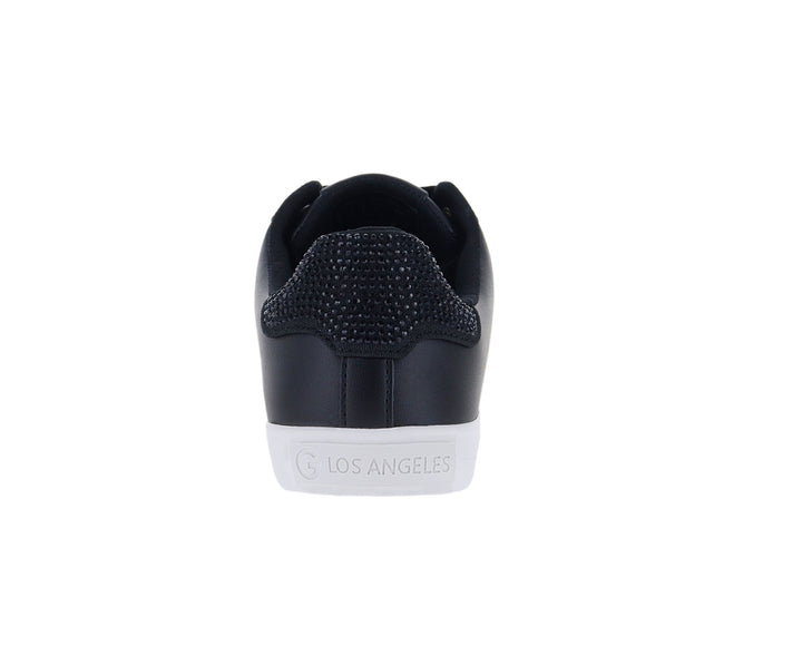 Tenis GBG color negro con suela blanca y detalles brillantes en el talón para mujer.