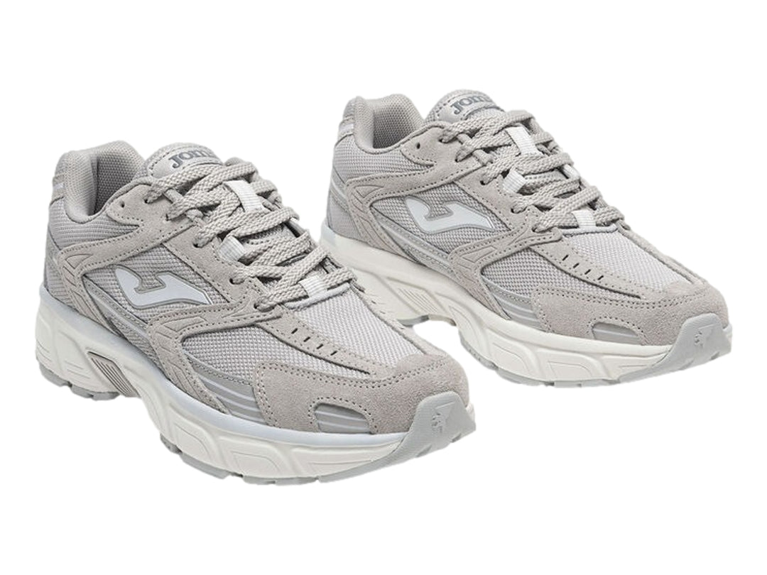 Tenis deportivos Joma modelo RT50 en color gris con detalles blancos y suela blanca robusta para mujer.