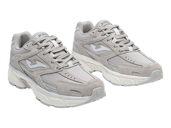 Tenis deportivos Joma modelo RT50 en color gris con detalles blancos y suela blanca robusta para mujer.
