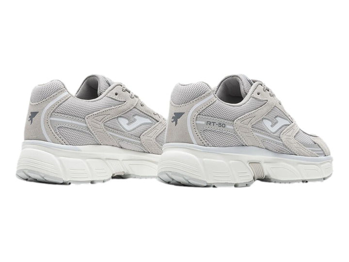 Tenis deportivos Joma modelo RT50 en color gris con detalles blancos y suela blanca robusta para mujer.