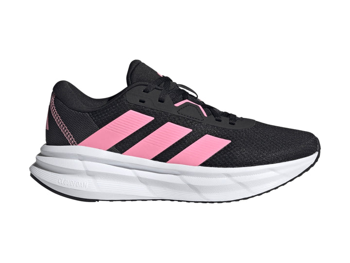 Tenis deportivos Adidas color negro con franjas rosas y suela blanca.