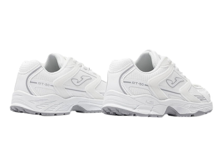 Tenis deportivos Joma color blanco con detalles y suela en color gris.