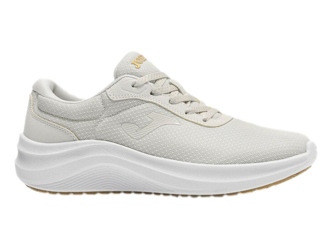 Tenis deportivos Joma para mujer en color blanco con suela blanca y tejido transpirable.