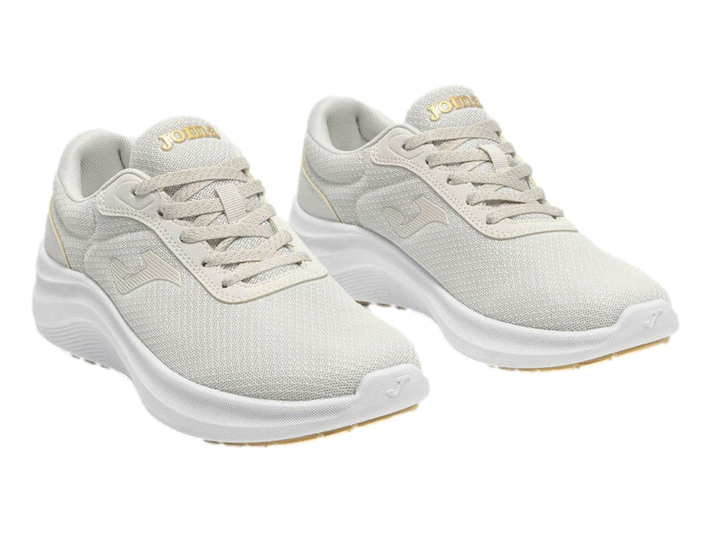 Tenis deportivos Joma para mujer en color blanco con suela blanca y tejido transpirable.