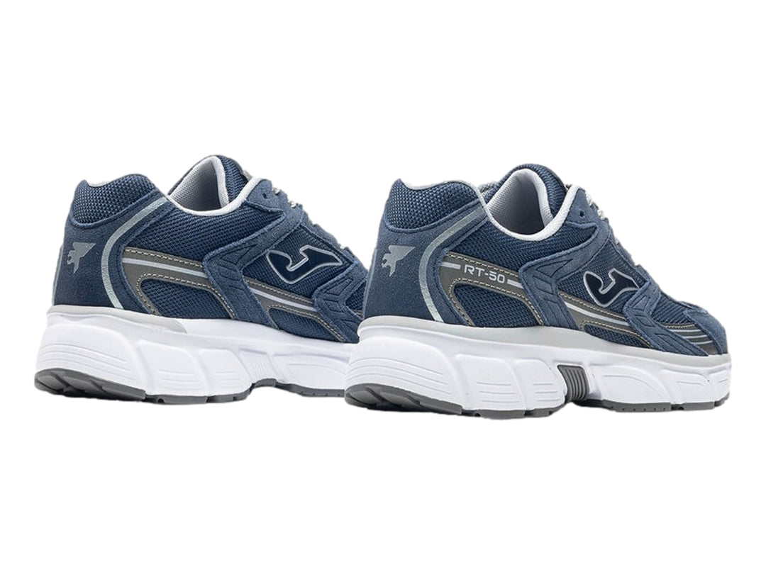 Tenis deportivos Joma color azul marino con suela blanca y detalles en gris.