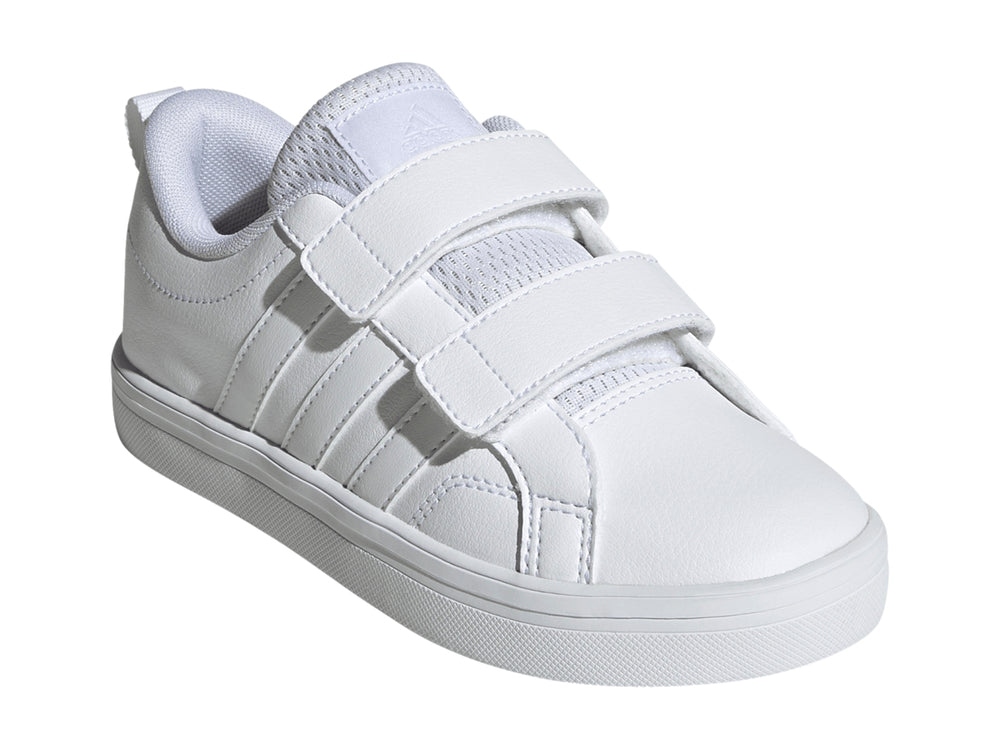 Tenis Adidas blancos de corte bajo con cierre de velcro y suela blanca.
