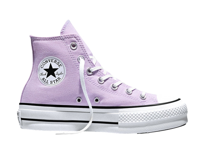 Tenis Converse de bota alta color lila con suela de plataforma blanca.