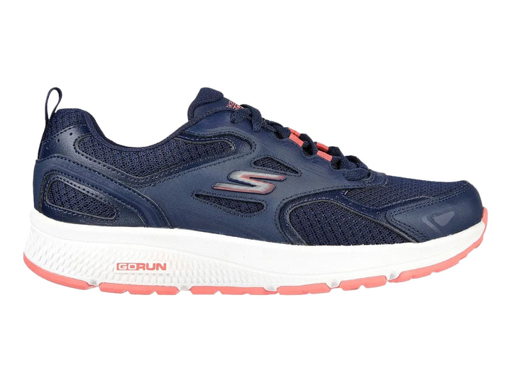 Tenis deportivos Skechers color azul marino con suela blanca y detalles en rosa.
