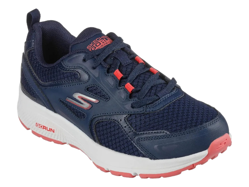 Tenis deportivos Skechers color azul marino con suela blanca y detalles en rosa.