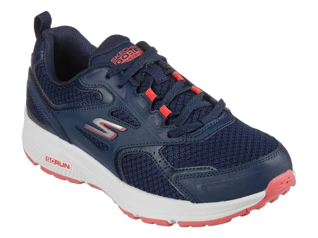 Tenis deportivos Skechers color azul marino con suela blanca y detalles en rosa.