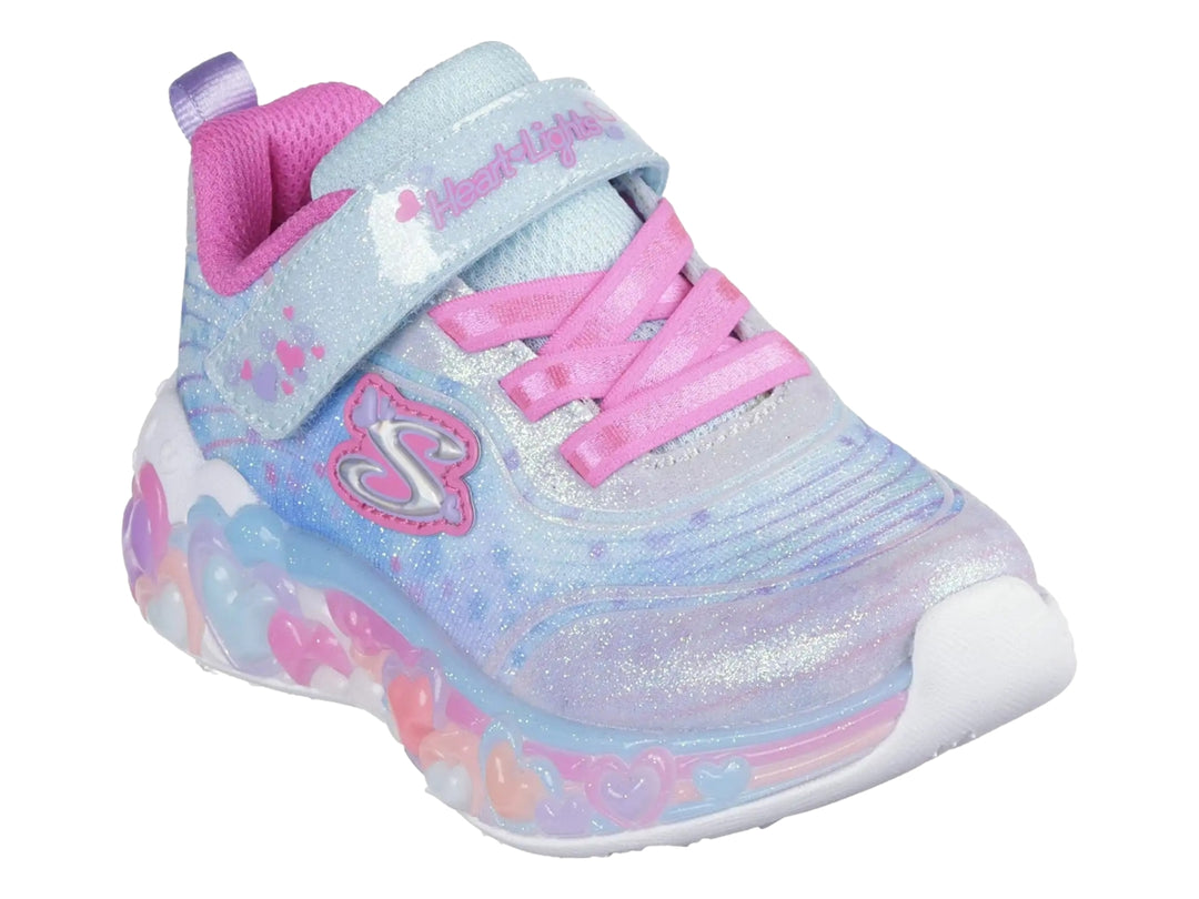 Tenis SKECHERS para niña color azul y rosa con suela de corazones iluminados y acabado brillante.