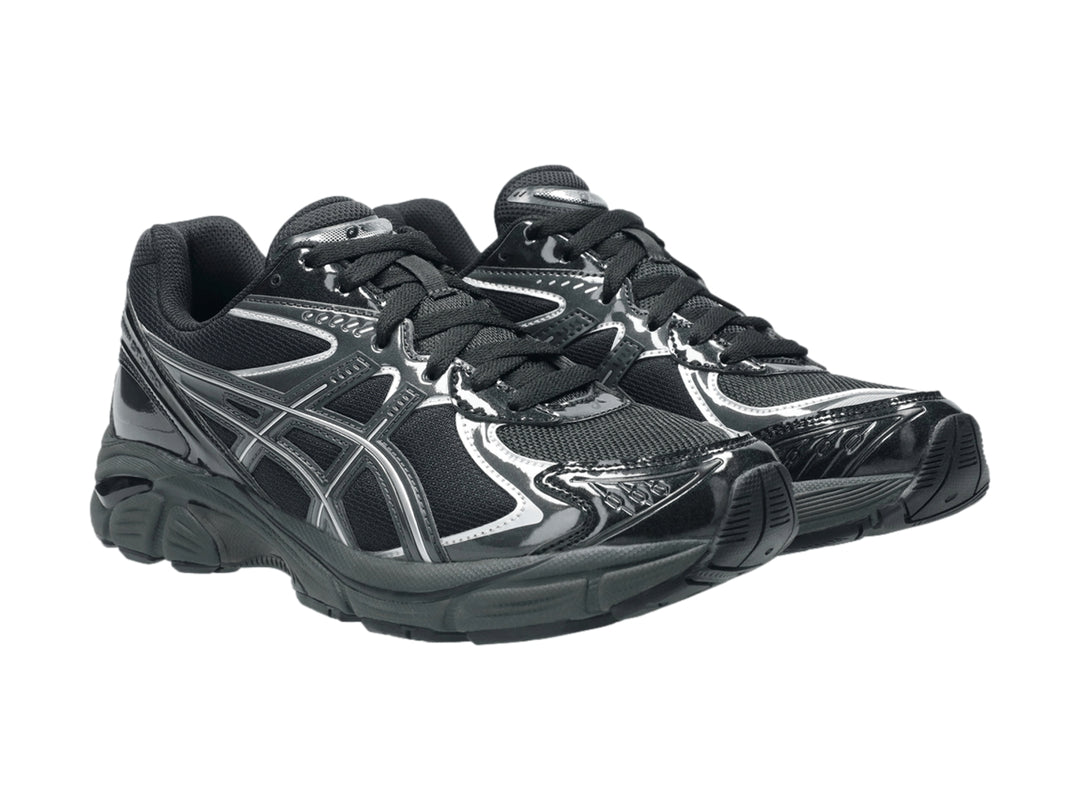 Tenis deportivos ASICS GT-2160 color negro con detalles plateados, vista lateral sobre fondo blanco.