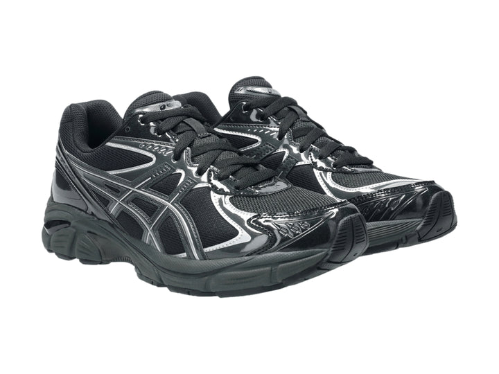 Tenis deportivos ASICS GT-2160 en color negro con detalles plateados, vista lateral.