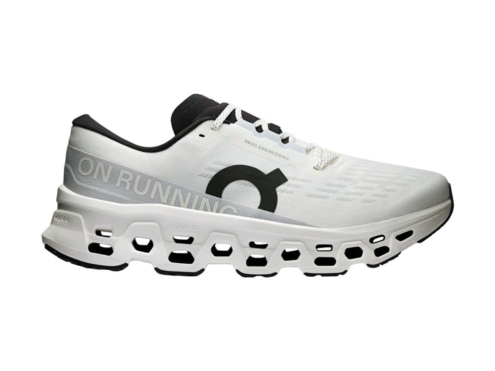 Tenis deportivos On Cloud Cloudmonster 3 color blanco con detalles negros y suela con tecnología de amortiguación.