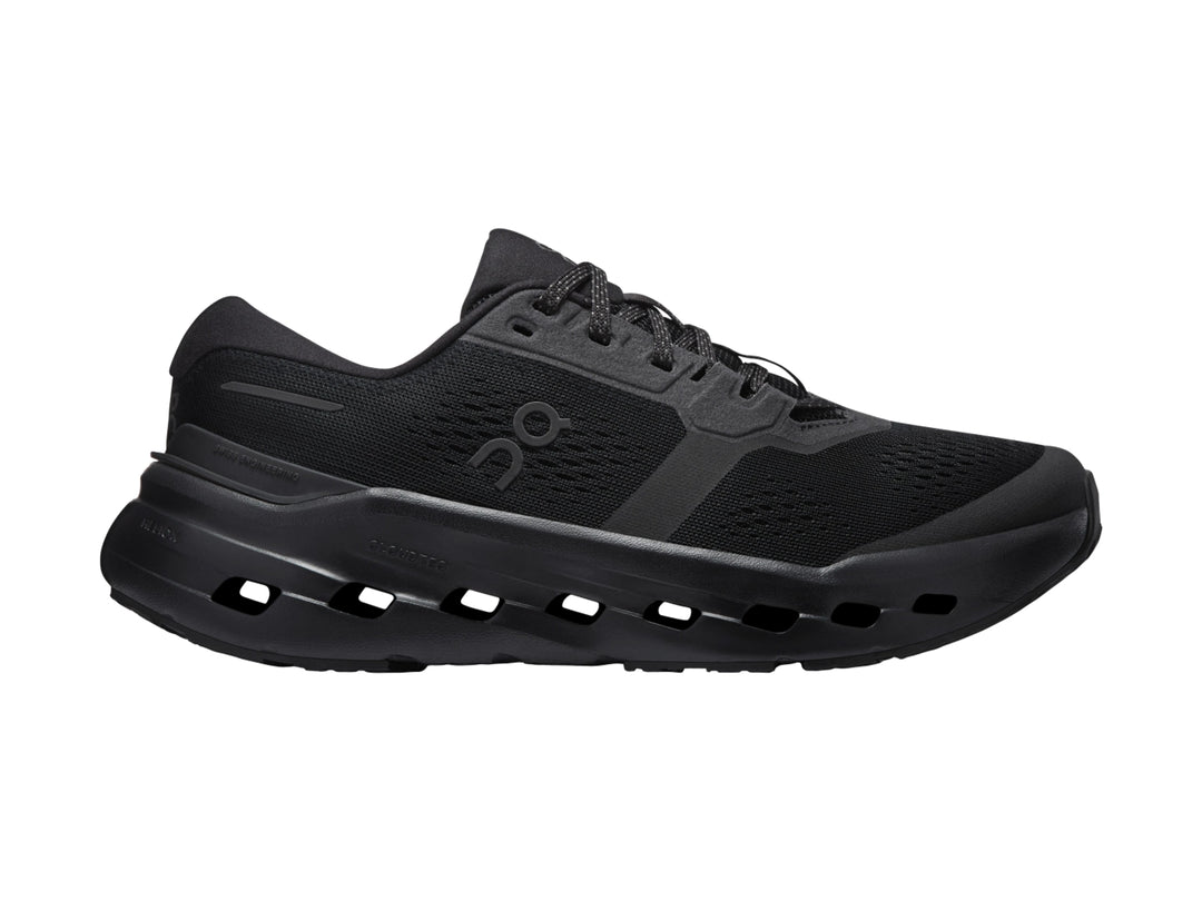 Tenis deportivos On Cloud color negro con suela de celdas huecas y parte superior de malla.