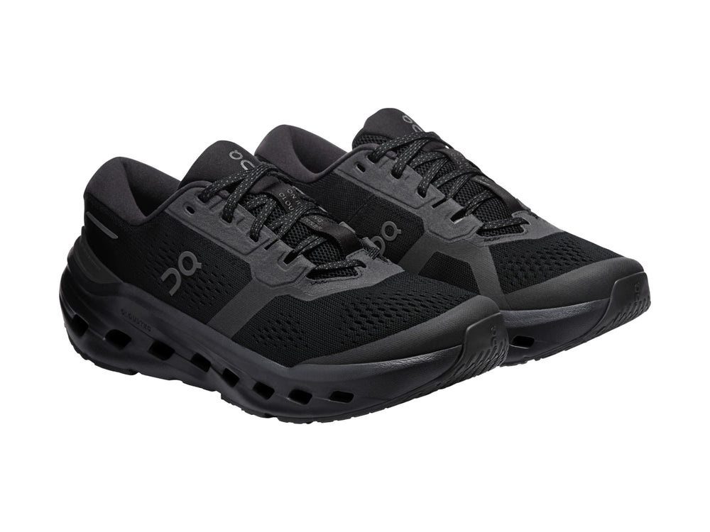 Tenis deportivos On Cloud color negro con suela de celdas huecas y parte superior de malla.