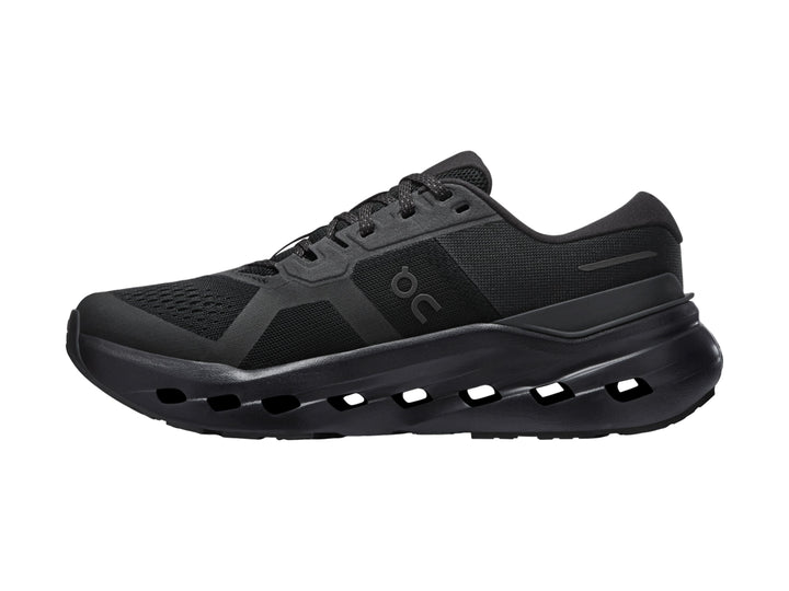 Tenis deportivos On Cloud color negro con suela de celdas huecas y parte superior de malla.