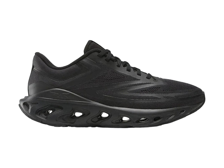 Tenis deportivos Reebok Fuel Flex Run color negro con suela perforada y malla transpirable.