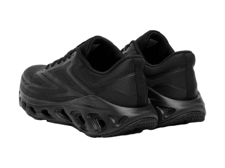 Tenis deportivos Reebok Fuel Flex Run color negro con suela perforada y malla transpirable.