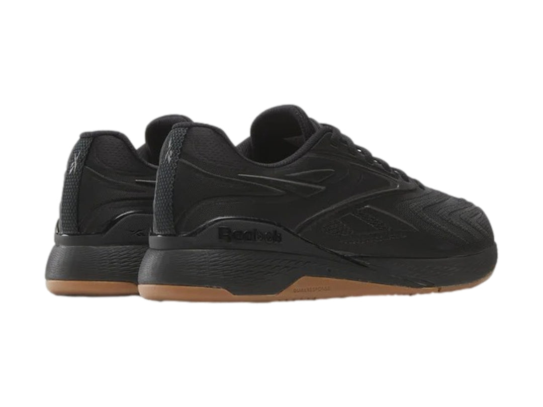 Tenis deportivos Reebok Nano X5 Edge color negro con suela café, vista lateral.