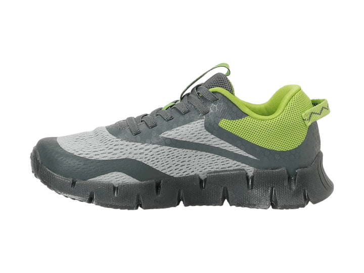 Tenis deportivos Reebok color gris con detalles en verde lima y suela gruesa texturizada.